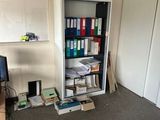 an image of a room with a bookcase and a television
