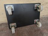 a picture of a black board with four wheels on it