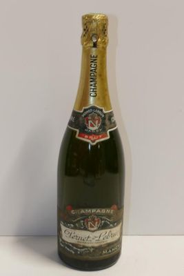 an image of a bottle of champagne sitting on a table