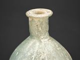 an image of a green glass vase on a black background