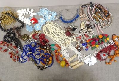 a lot of jewelry that is laying out on the table