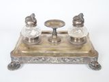 two salt and pepper shakers sitting on a tray