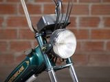 a close up of a bike with a light on it