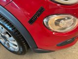 a close up of a car ' s headlight with a sticker on it