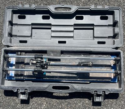 a case with tools in it sitting on the ground