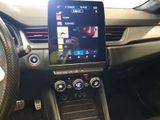 the dashboard of a car with a tablet on the dashboard