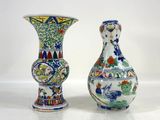 two vases sitting next to each other on a table