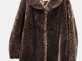brown leopard print coat on hanger against white background