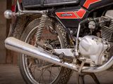 a close up of a motorcycle parked in a garage