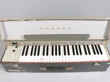 an old piano that is sitting on a table