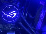 the inside of a computer case with a blue light on top of it