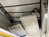 a stack of boxes and a radiator in a garage