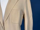 an image of a tan suit on a mannequin dummy