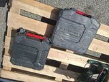 two plastic containers sitting on a pallet next to each other