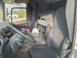 a view of the inside of a truck with the driver ' s seat up