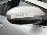 a sticker on the side mirror of a car that says vauto