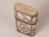a small box with a design on it on a white surface