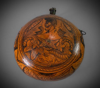 une image représentant un bol en bois orné d'un motif