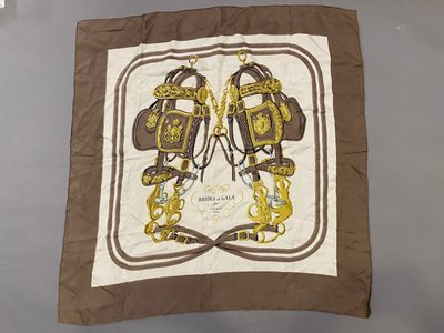 a brown and white scarf with a picture of a horse