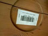 a close up of a wooden drawer with a label on it