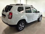 a picture of a white dacia parked in a garage