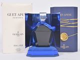 a bottle of perfume sitting next to a box of perfume