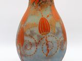 a vase with a design on it on a white surface