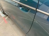 a close up of a car door handle with the door handle open