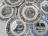 many plates that have pictures of people on them