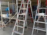 many ladders that are sitting in a building