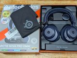 the box is open on the table with the headphones in it