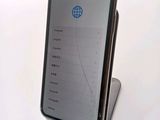 an image of a cell phone sitting on top of a stand