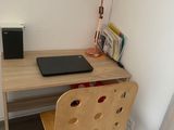 a wooden desk with a laptop on top of it