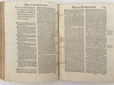 an open book with a page of text on it sitting on a table