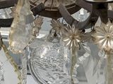 a chandelier that has a lot of glass hanging from it