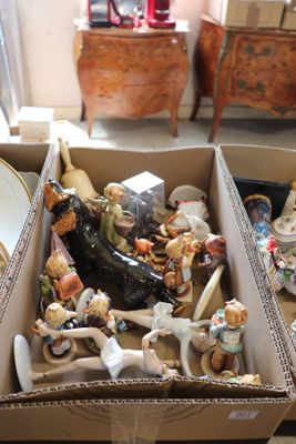 a box full of figurines sitting on the floor
