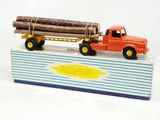 a toy truck with a log on the back of it
