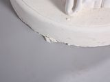 a toothbrush that is sitting on top of a white plate
