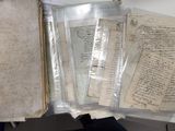 a book with a bunch of papers inside of it