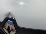 a reflection of a building in the side mirror of a car