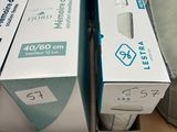 two boxes of wii remotes sitting on top of a table