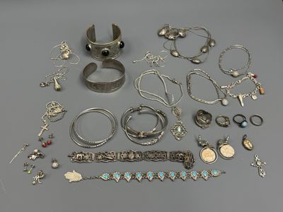 several different types of bracelets and rings on a table