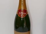 a bottle of champagne sitting on a white table