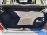 a trunk of a car with a seat folded down