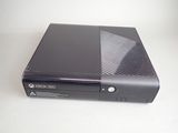 xbox 360 console sitting on top of a white table with its lid open