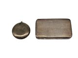 a small metal box and a small metal object