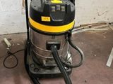 a wet vacuum that is sitting on the floor