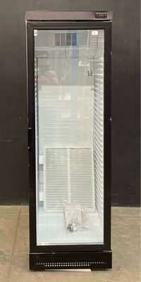 an image of a glass door refrigerator in a room