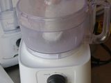 a food processor sitting on a counter next to a box of food