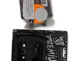a black and white picture of a pair of scissors and a black and white package